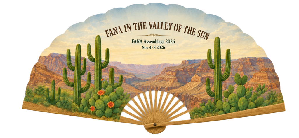 A fan with a color drawing of a desert.